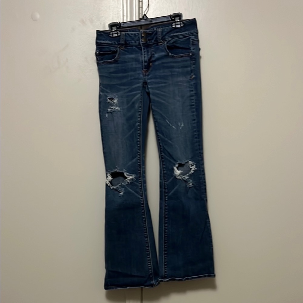 Women's Blue Distressed Jeans
Artist flare